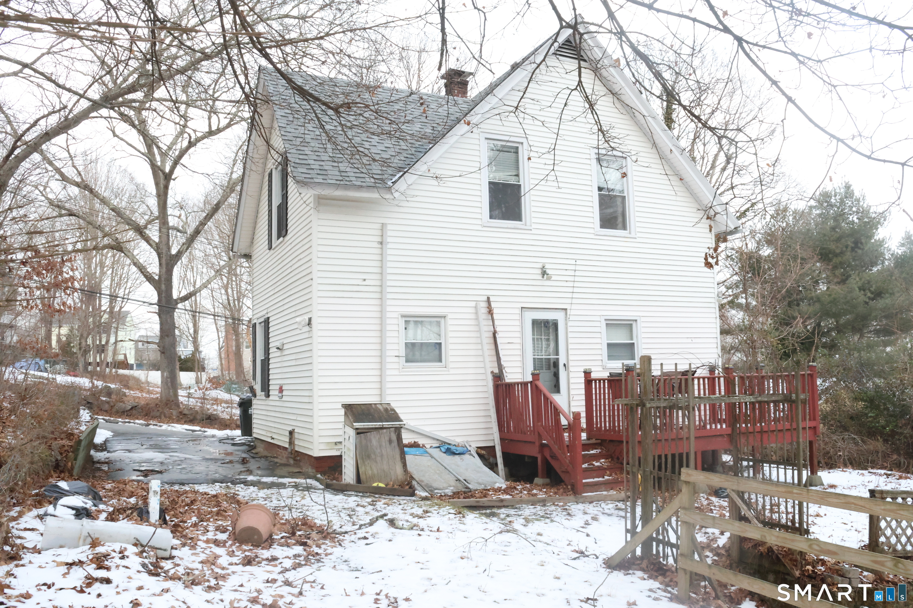 100 7th Street Norwich, CT 06360 - Photo 5 of 32 a view of a white house with a yard and sitting area