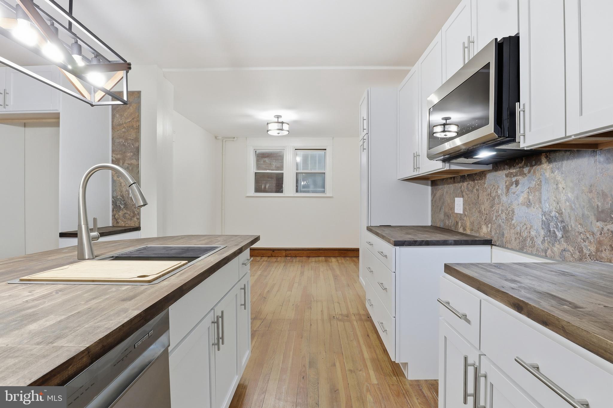33 Sprenkle Avenue Hanover, PA 17331 - Photo 16 of 53 a kitchen with granite countertop stainless steel appliances and wooden cabinets