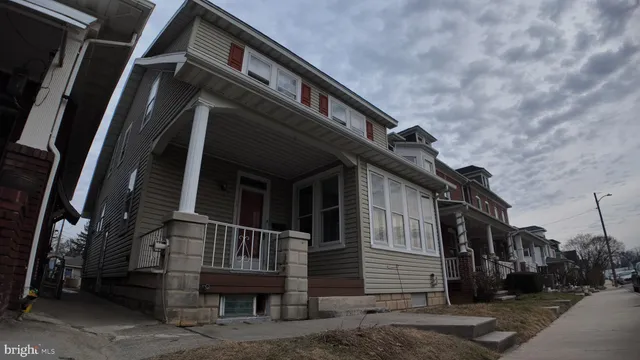 a view of house with a street