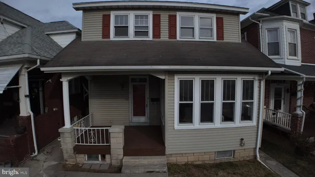 a front view of a house with porch