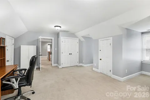 a view of room with furniture and windows