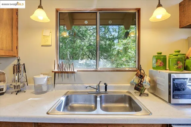 a kitchen with a sink and a window