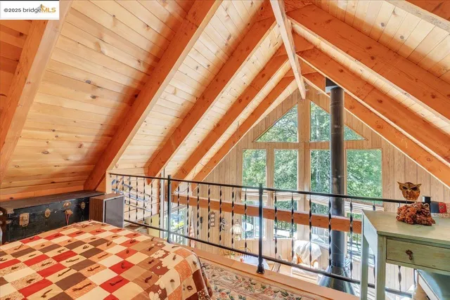 a view of balcony with two chairs and wooden floor