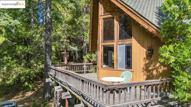 an aerial view of a house with outdoor space and street view
