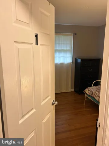 a living room with furniture and a mirror
