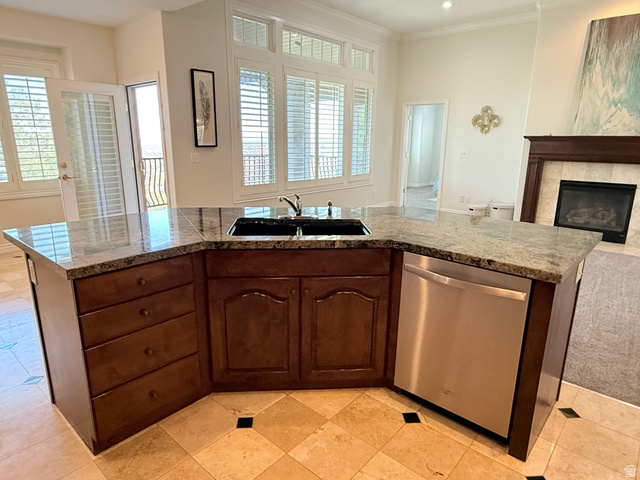 1562 Fairway Ridge Road Draper, UT 84020 - Photo 15 of 60 Angled kitchen island featuring granite countertops, an integrated double basin sink, and stainless steel dishwasher