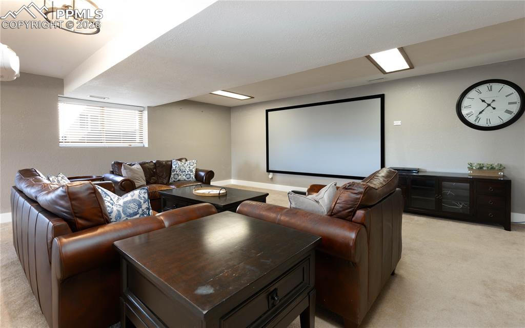 17840 New London Road Monument, CO 80132 - Photo 21 of 38 Basement theater area with included screen and projector