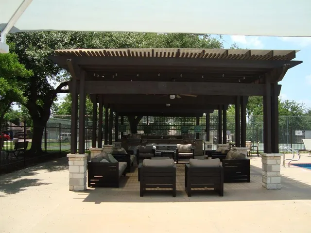 a view of a swimming pool with a patio