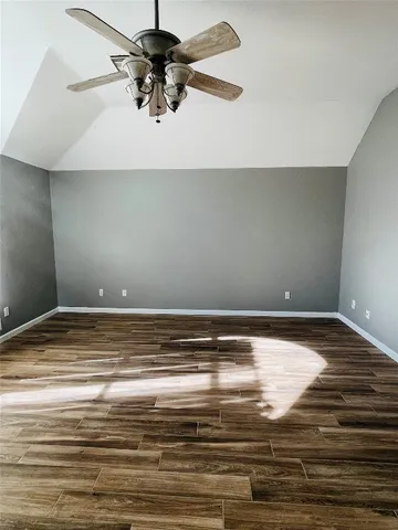 a view of kitchen with wooden floor and electronic appliances
