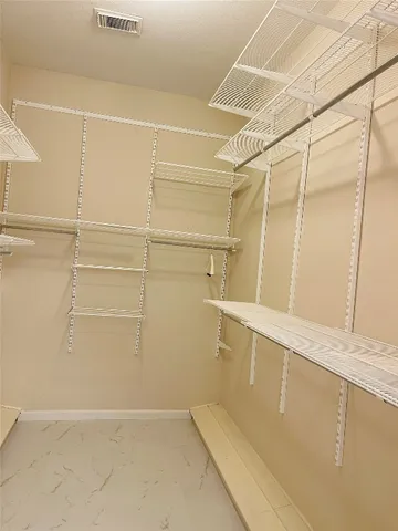 a view of a room with a sink and wooden floor