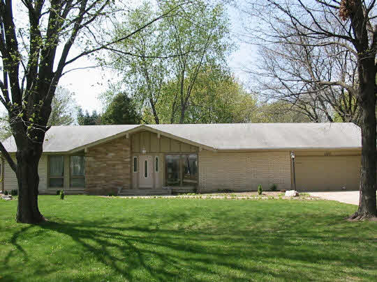 a view of a back yard of the house