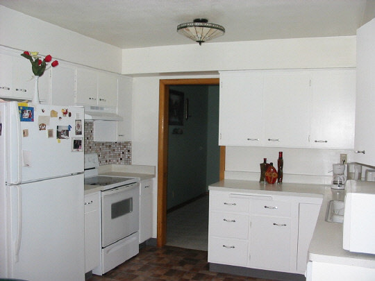 2970 Reid Farm Road Rockford, IL 61114 - Photo 4 of 6 a kitchen with white cabinets and white appliances