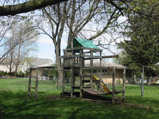 2970 Reid Farm Road Rockford, IL 61114 - Photo 5 of 6 a front view of a house with a yard table and chairs