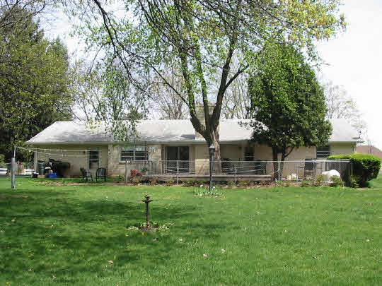 2970 Reid Farm Road Rockford, IL 61114 - Photo 6 of 6 a backyard of a house with table and chairs