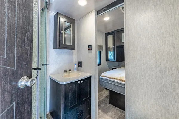 a en suite bathroom with a sink and a mirror