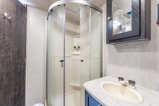 a bathroom with a sink and mirror