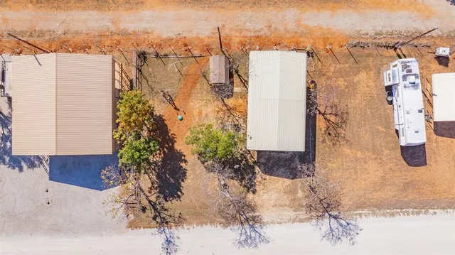 an aerial view of a house with outdoor space