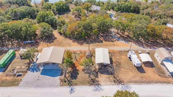 an aerial view of a house with a lake view