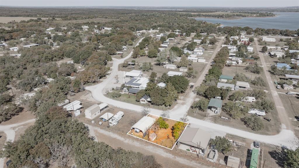 357 Discovery Bay Road Comanche, TX 76442 - Photo 28 of 32 an aerial view of residential houses with outdoor space
