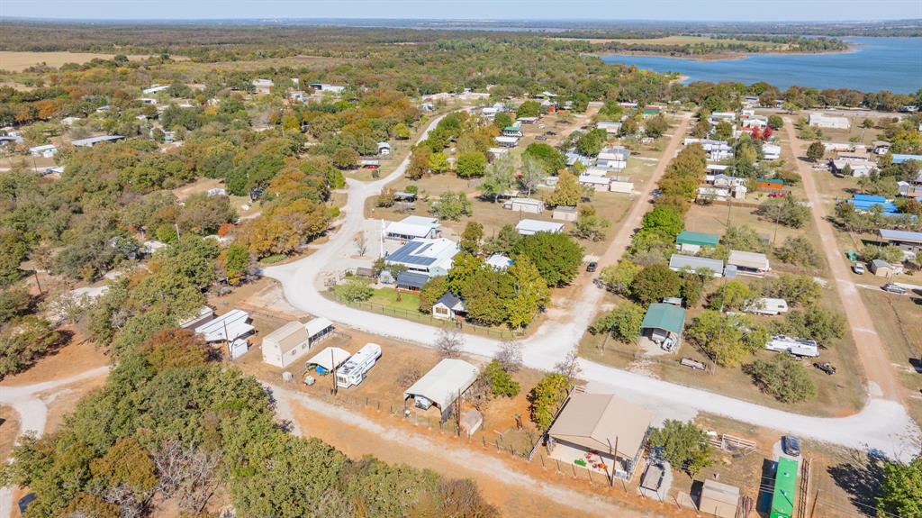357 Discovery Bay Road Comanche, TX 76442 - Photo 29 of 32 an aerial view of residential houses with outdoor space