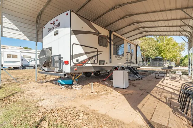 a view of a swimming pool with sitting area