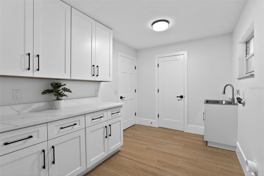 1815 Seneca Boulevard Winter Springs, FL 32708 - Photo 13 of 32 a view of a kitchen with white cabinets