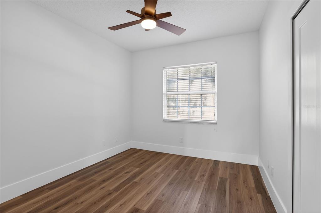 1815 Seneca Boulevard Winter Springs, FL 32708 - Photo 22 of 32 wooden floor in an empty room with a window