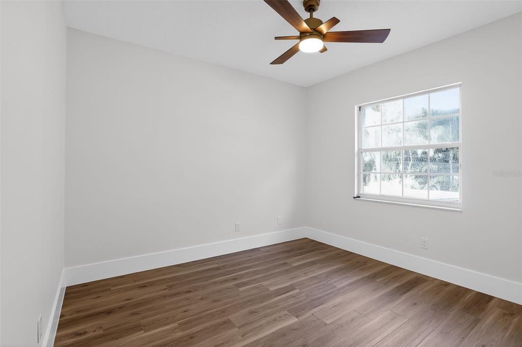 1815 Seneca Boulevard Winter Springs, FL 32708 - Photo 26 of 32 wooden floor in an empty room with a window