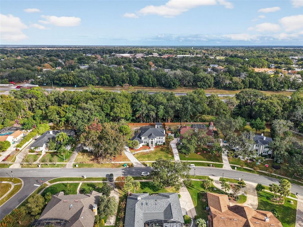 1815 Seneca Boulevard Winter Springs, FL 32708 - Photo 31 of 32 an aerial view of a city with lots of residential buildings ocean and mountain view in back