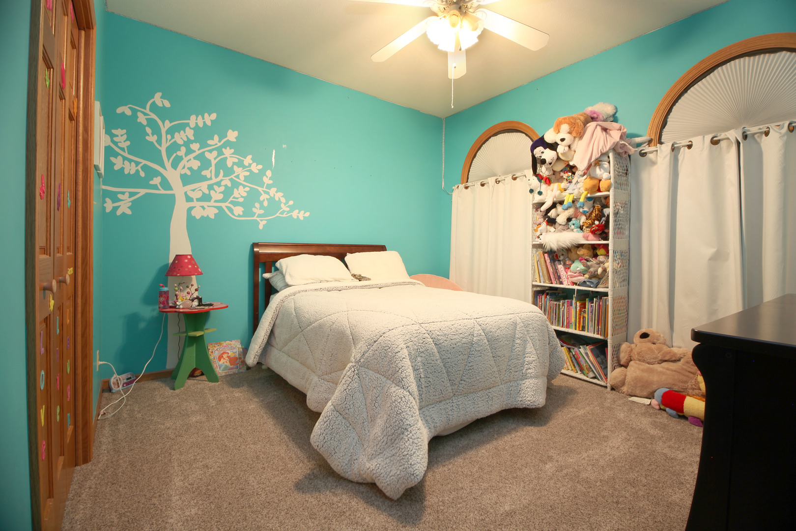 600 East Southmor Road Morris, IL 60450 - Photo 22 of 32 a bed sitting in a bedroom next to a window and a chandelier