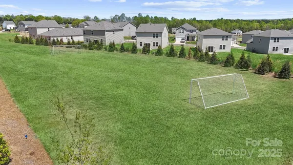 a view of backyard with a garden and entertaining space