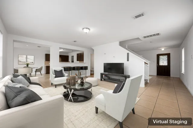 a living room with furniture and a flat screen tv