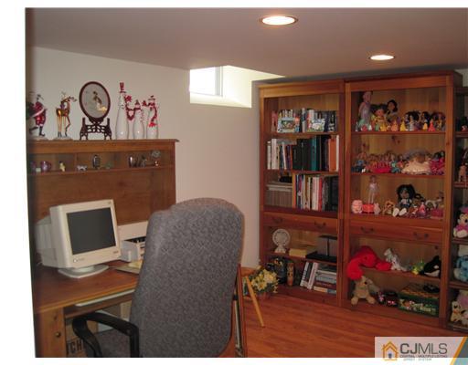 31 Lexington Road Monmouth Junction, NJ 08852 - Photo 11 of 12 a workspace with furniture and closet