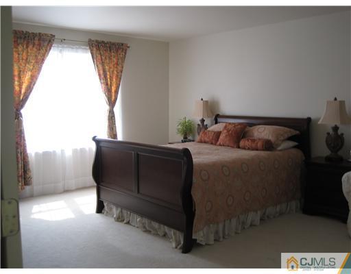 31 Lexington Road Monmouth Junction, NJ 08852 - Photo 8 of 12 a bedroom with a bed and window