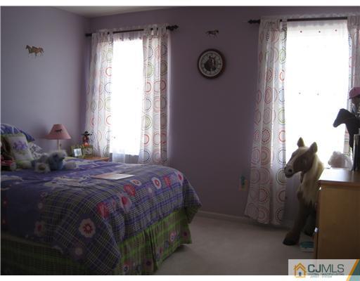 31 Lexington Road Monmouth Junction, NJ 08852 - Photo 9 of 12 a bedroom with a bed and a window