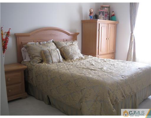 31 Lexington Road Monmouth Junction, NJ 08852 - Photo 10 of 12 a bedroom with a bed and a window