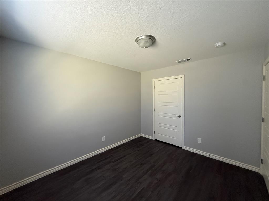 705 South Binkley Street Sherman, TX 75092 - Photo 17 of 22 wooden floor in an empty room