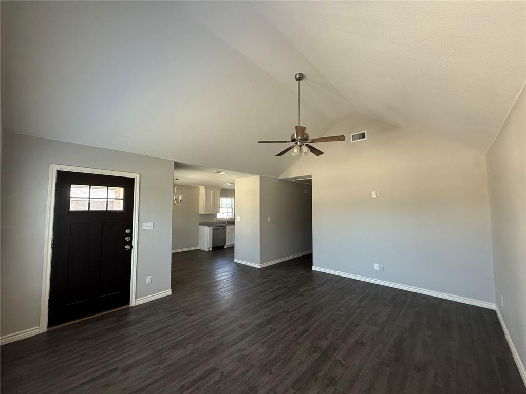 705 South Binkley Street Sherman, TX 75092 - Photo 3 of 22 wooden floor in an empty room with a window