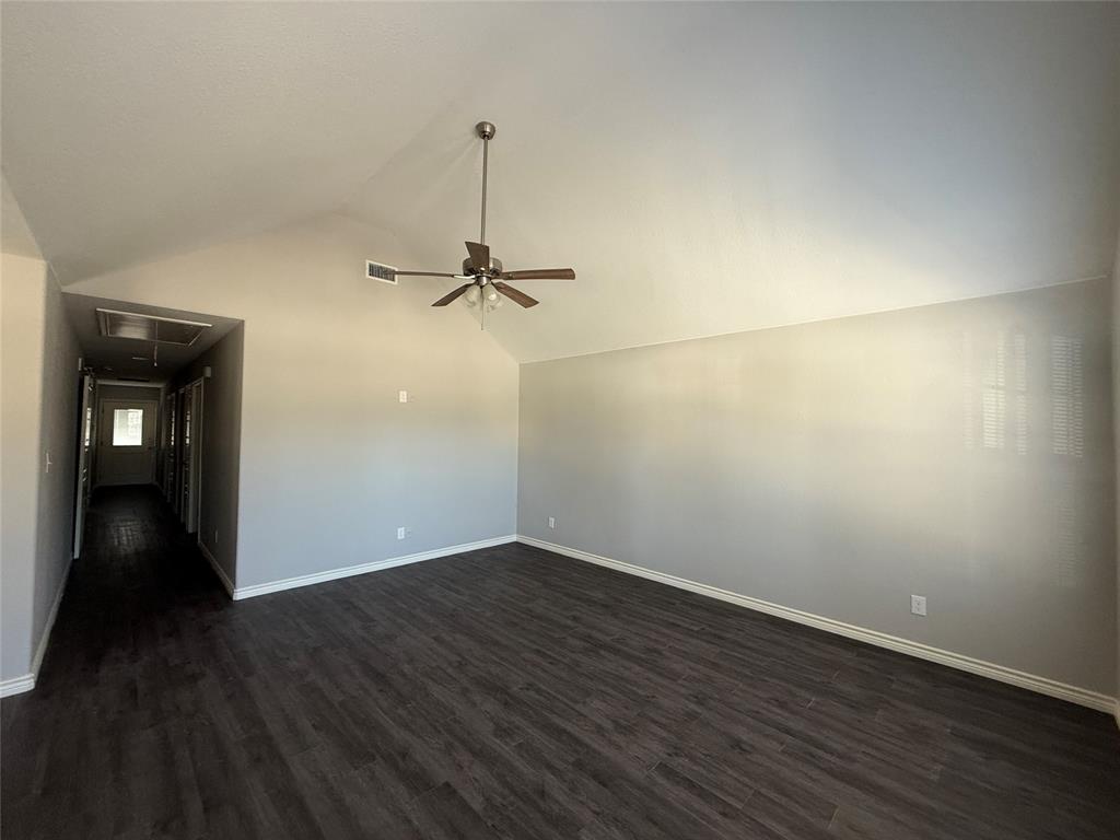 705 South Binkley Street Sherman, TX 75092 - Photo 5 of 22 a view of an empty room with wooden floor and closet