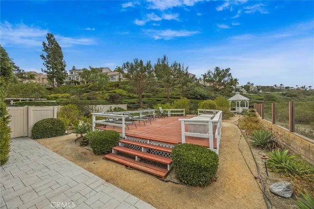 a balcony with outdoor seating and wooden floor
