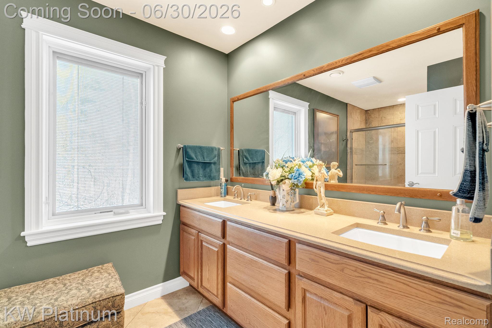 2235 South Lake Shore Road Harbor Beach, MI 48441 - Photo 39 of 99 Bathroom featuring a dual vanity with light-toned countertops and wood cabinetry