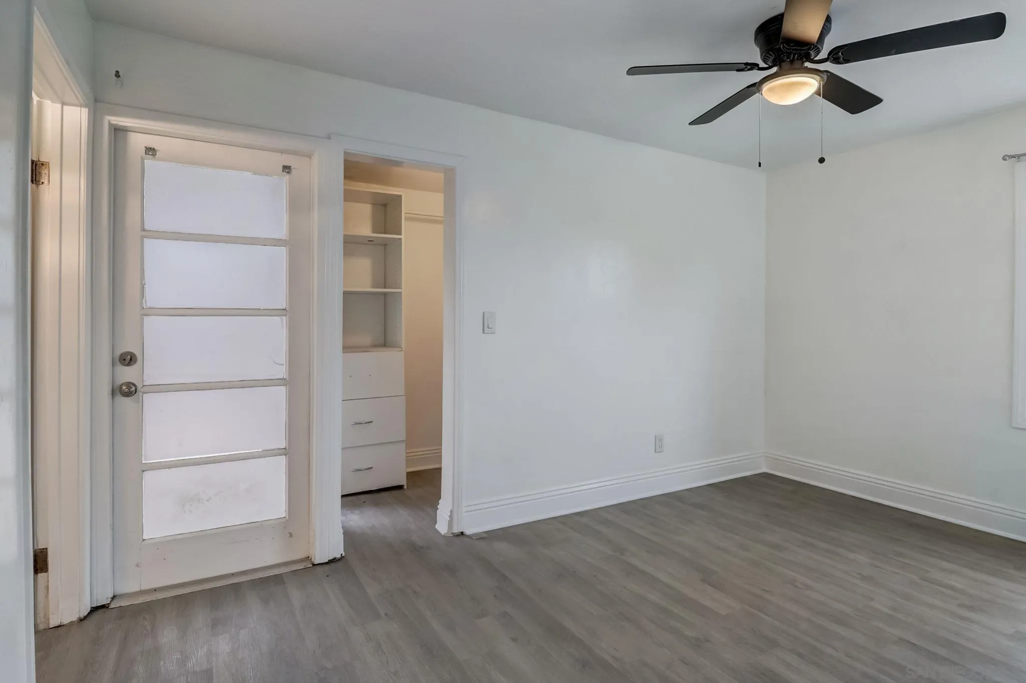9115 Rosedale Drive Spring Valley, CA 91977 - Photo 22 of 31 an empty room with a empty space and windows ceiling fan