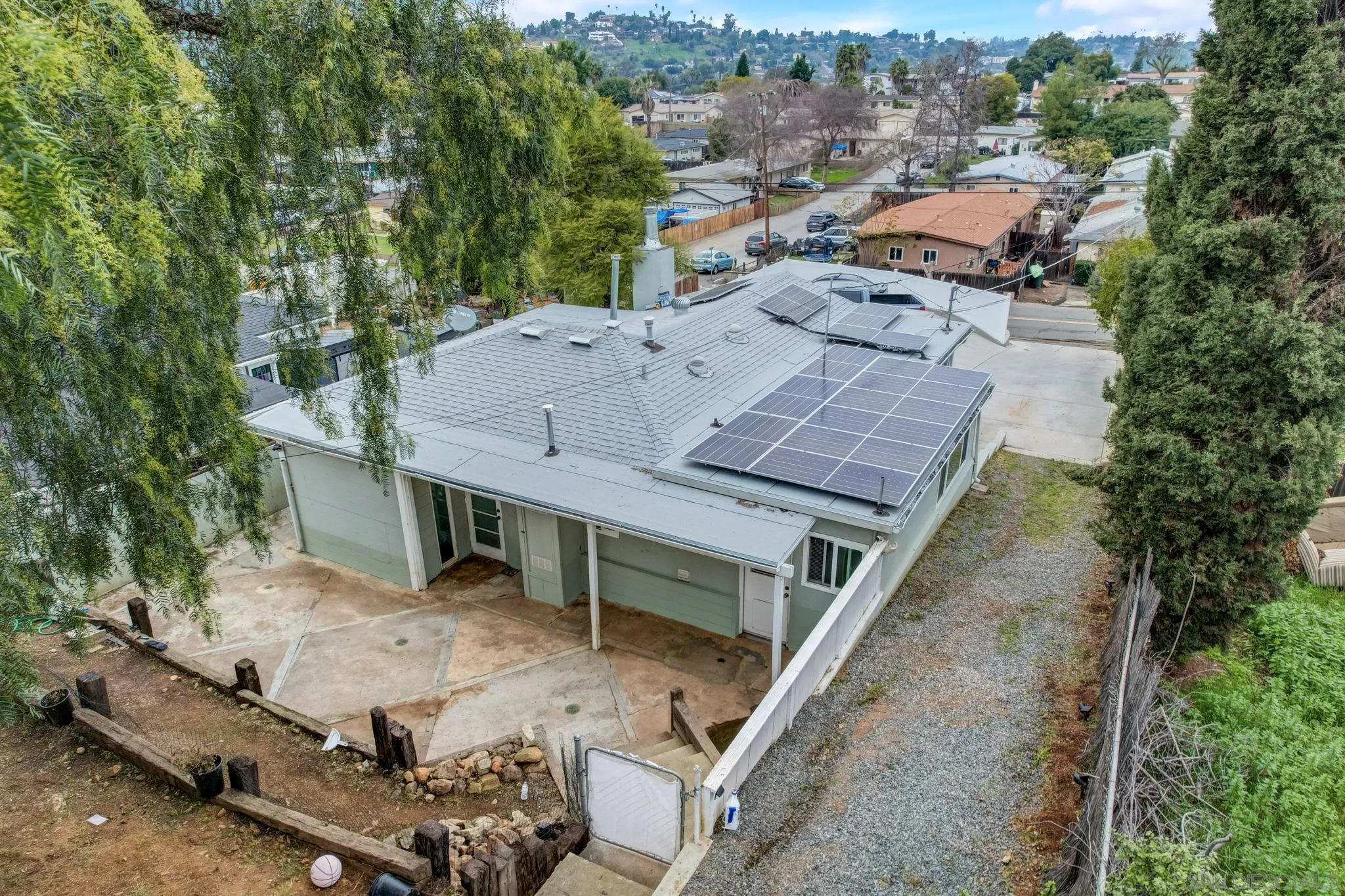 9115 Rosedale Drive Spring Valley, CA 91977 - Photo 30 of 31 an aerial view of a house with a yard and lake view