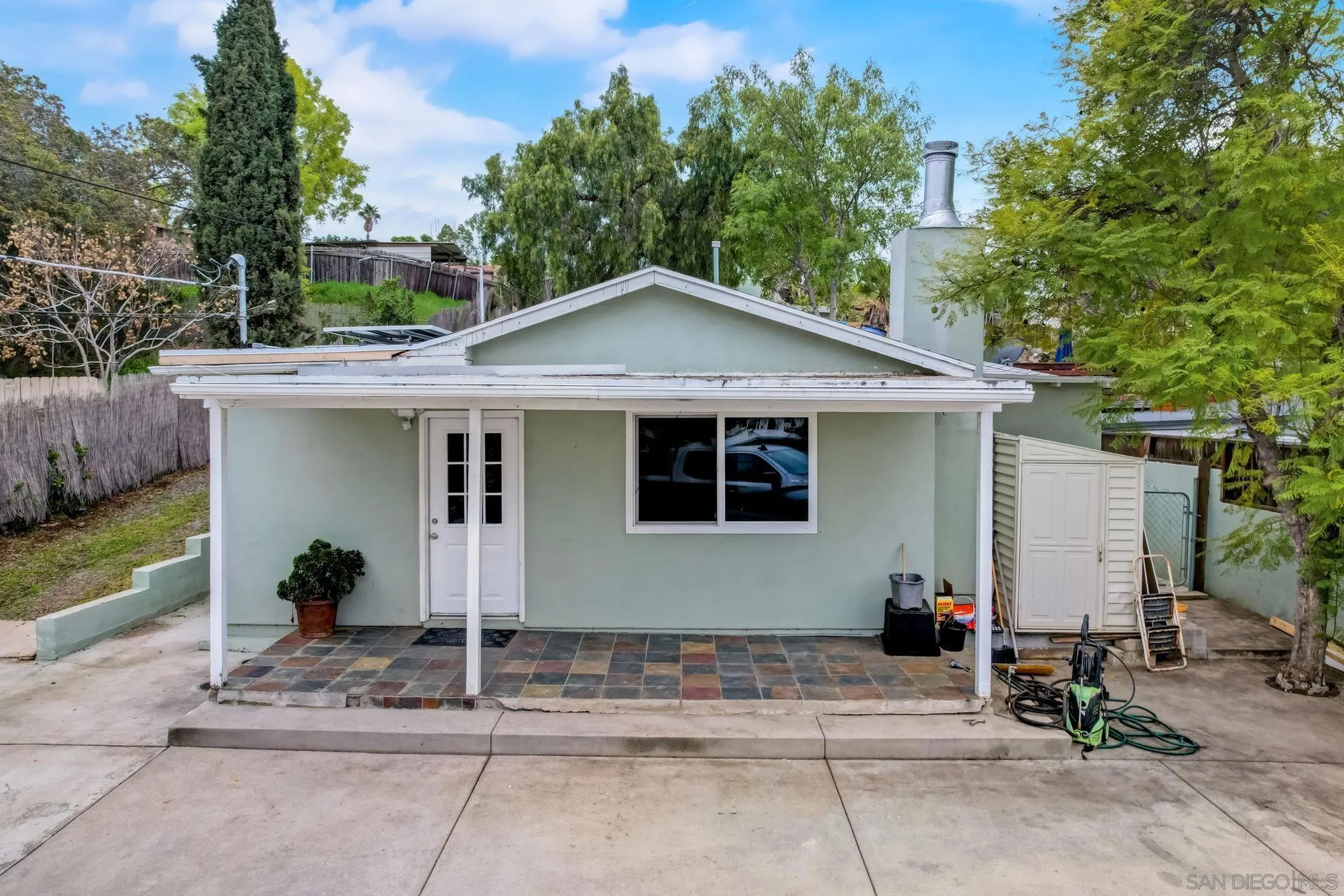 9115 Rosedale Drive Spring Valley, CA 91977 - Photo 4 of 31 a front view of a house with a garden