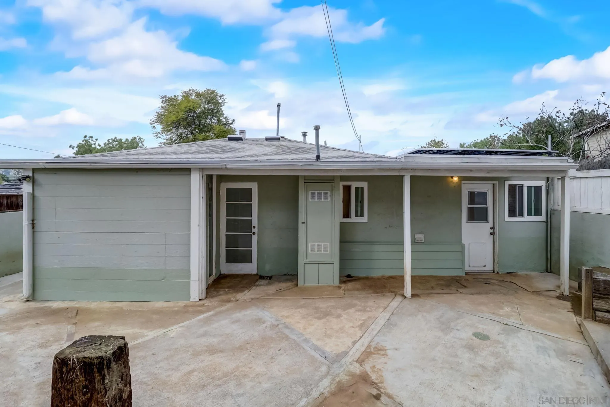 9115 Rosedale Drive Spring Valley, CA 91977 - Photo 9 of 31 a front view of a house with a garden