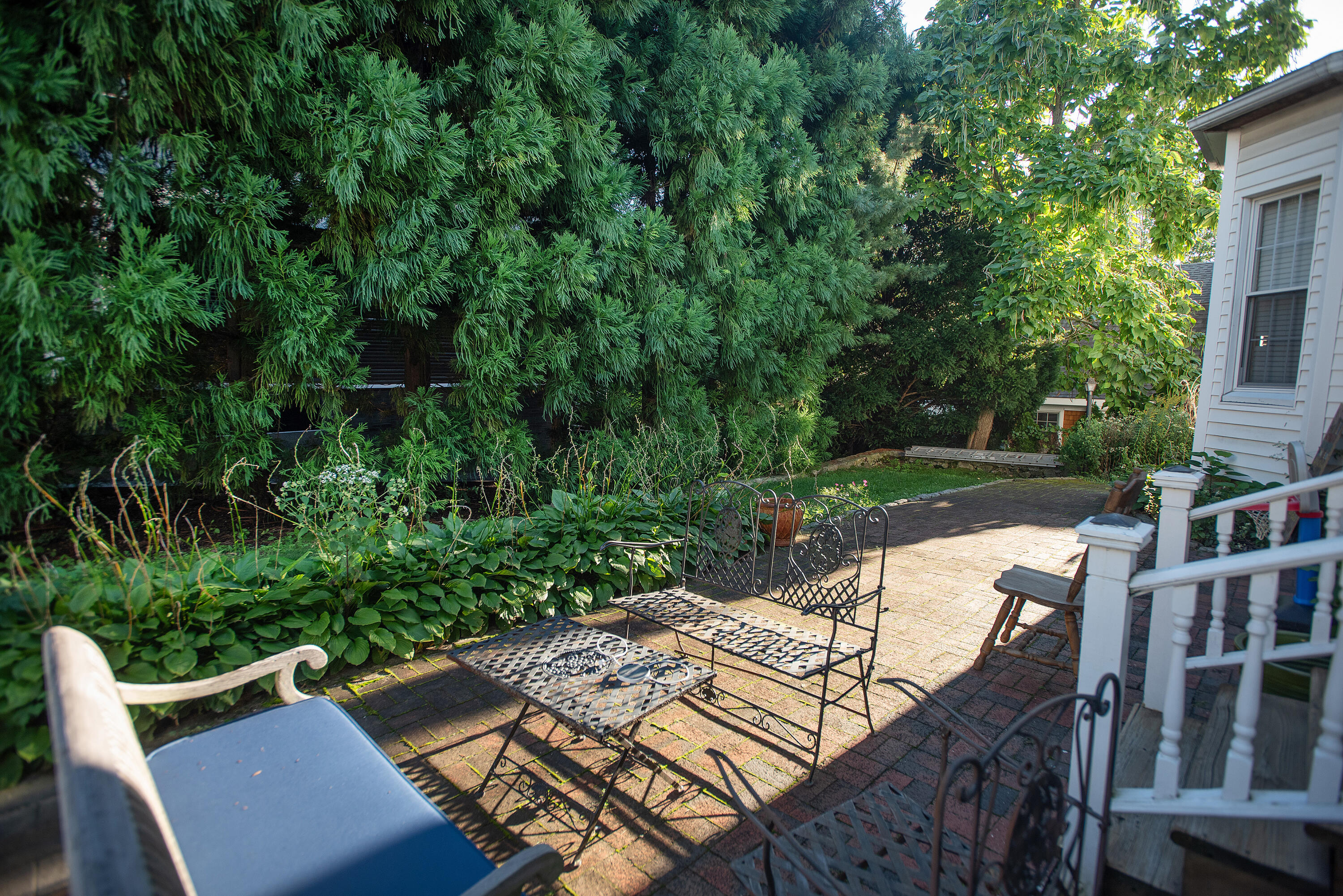 167 Park Street New Canaan, CT 06840 - Photo 18 of 18 a view of backyard with seating space and trees