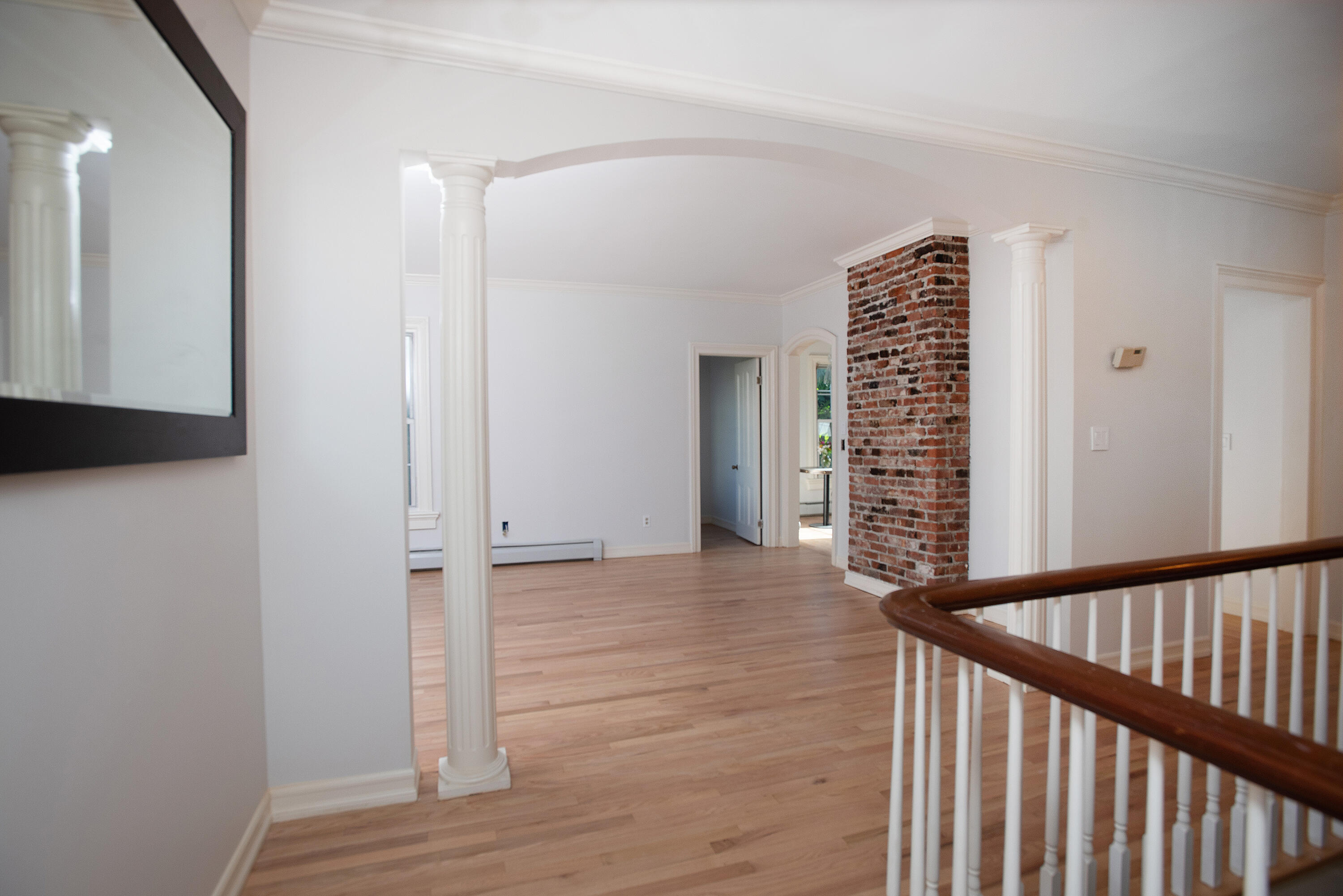 167 Park Street New Canaan, CT 06840 - Photo 2 of 18 a view of an empty room with wooden floor and a window