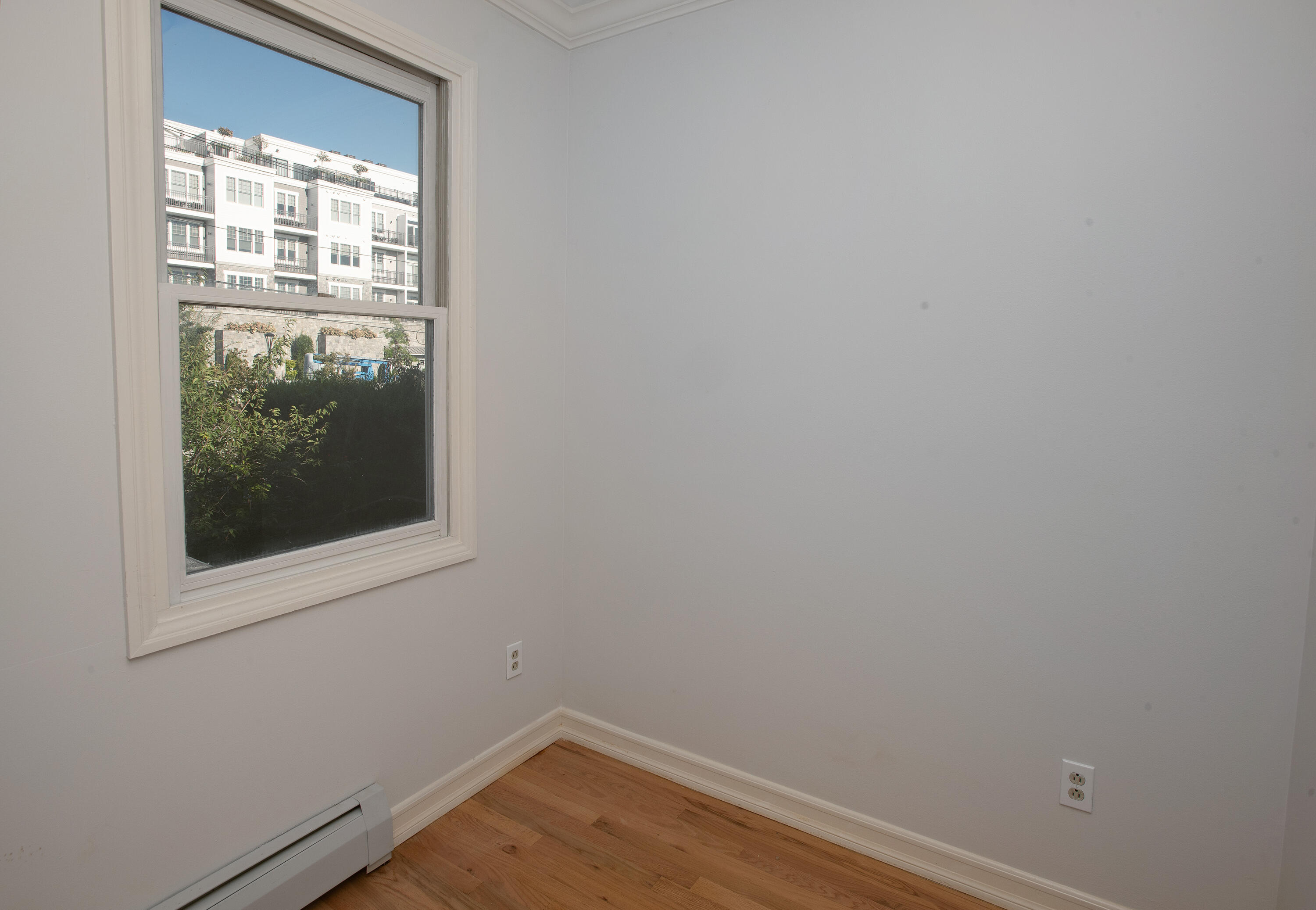 167 Park Street New Canaan, CT 06840 - Photo 10 of 18 a view of a small space with wooden floor and a window