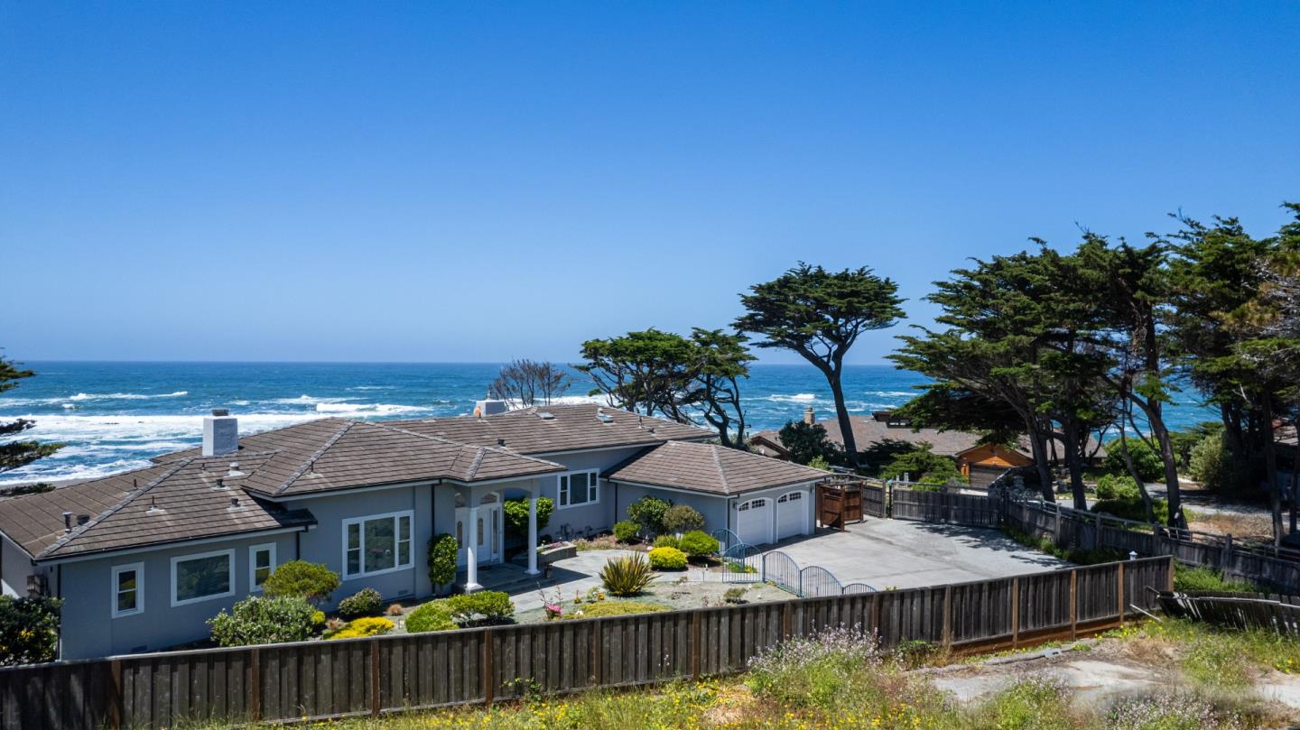 155 Reef Point Road Moss Beach, CA 94038 - Photo 13 of 16 a view of houses with water and city view
