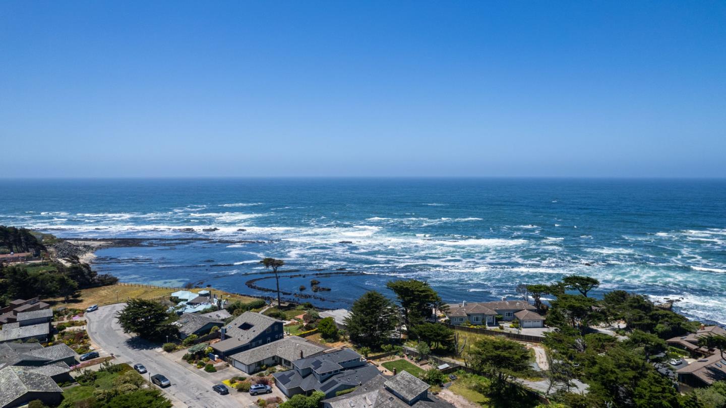 155 Reef Point Road Moss Beach, CA 94038 - Photo 15 of 16 a view of ocean with beach
